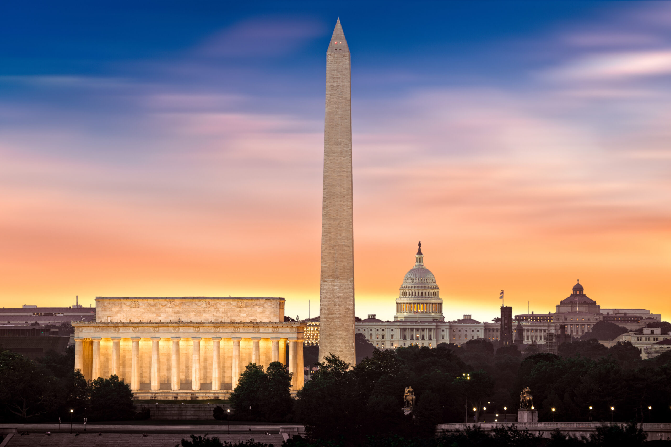 Lincoln Memorial, Washington Monument and U.S. Capitol in Washington, D.C. at sunset