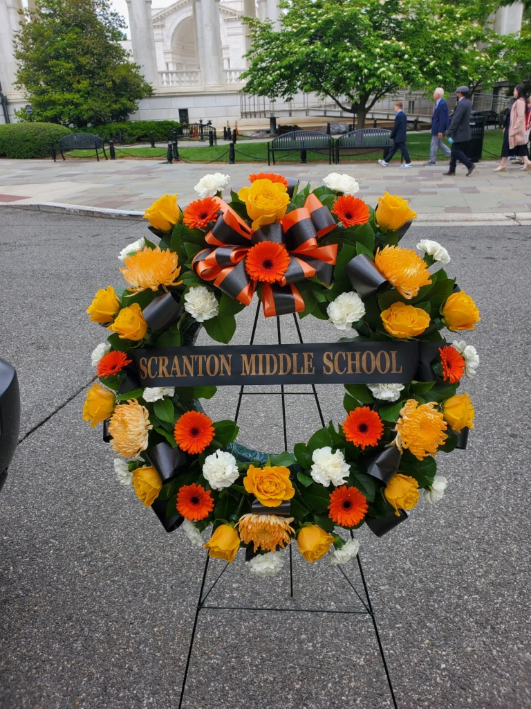 School wreath with ribbon prepared for a wreath-laying ceremony at Arlington National Cemetery