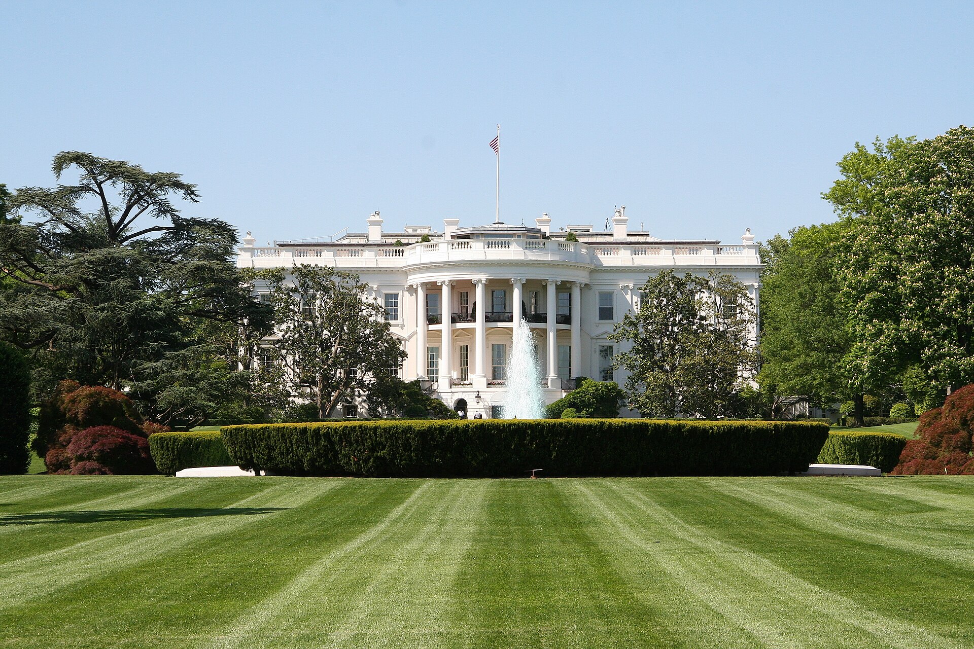 The South Portico of the White House seen across the South Lawn on a sunny day